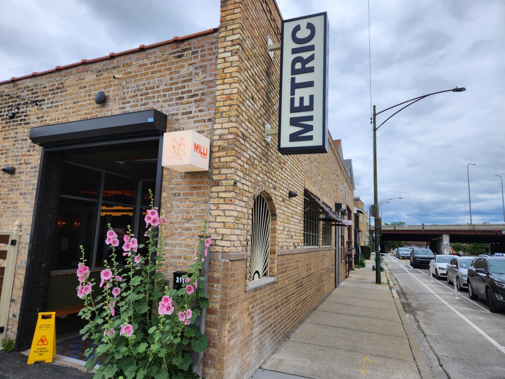 Whimsical pink Flowers on the entrance corner of Milli by METRIC Coffee; Near Belmont & Kedzie; in Avondale